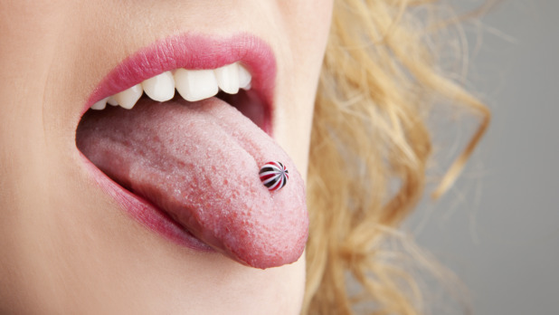 Woman has a piercing in the language