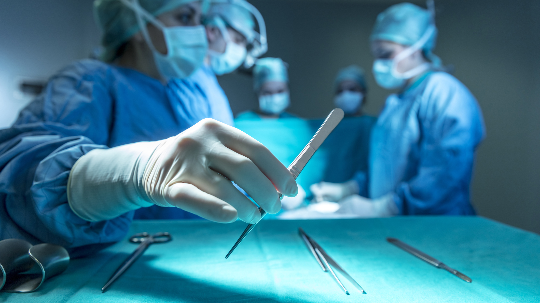 Surgeons in full surgical gear during operation