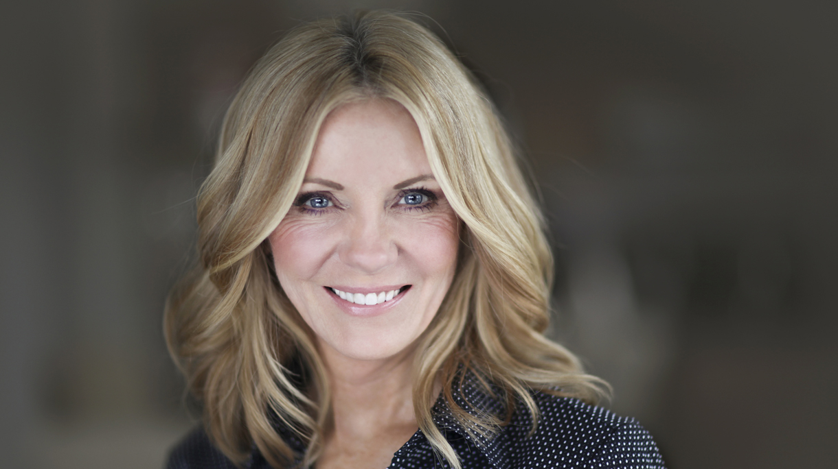 Portrait Of A Mature Businesswoman Smiling At The Camera