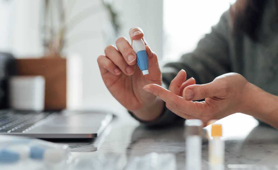 Cropped Shot Of Young Woman Doing Finger-prink Blood Test At Home