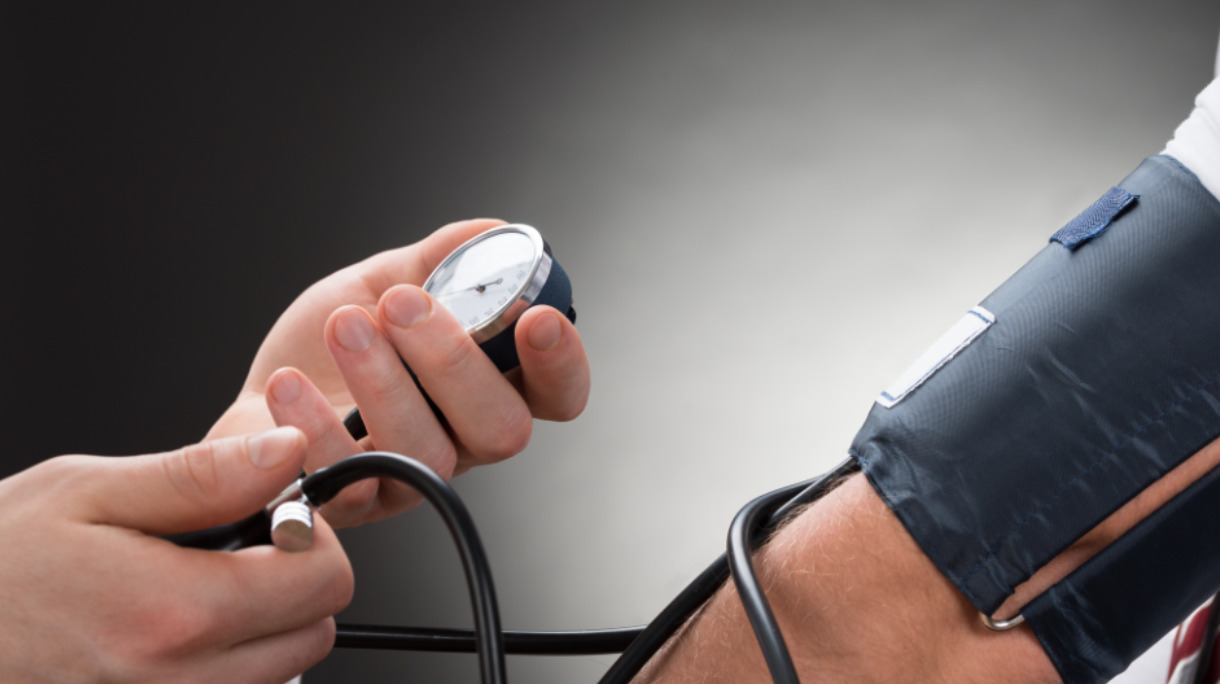 doctor-checking-blood-pressure-of-a-patient-picture-id516257748