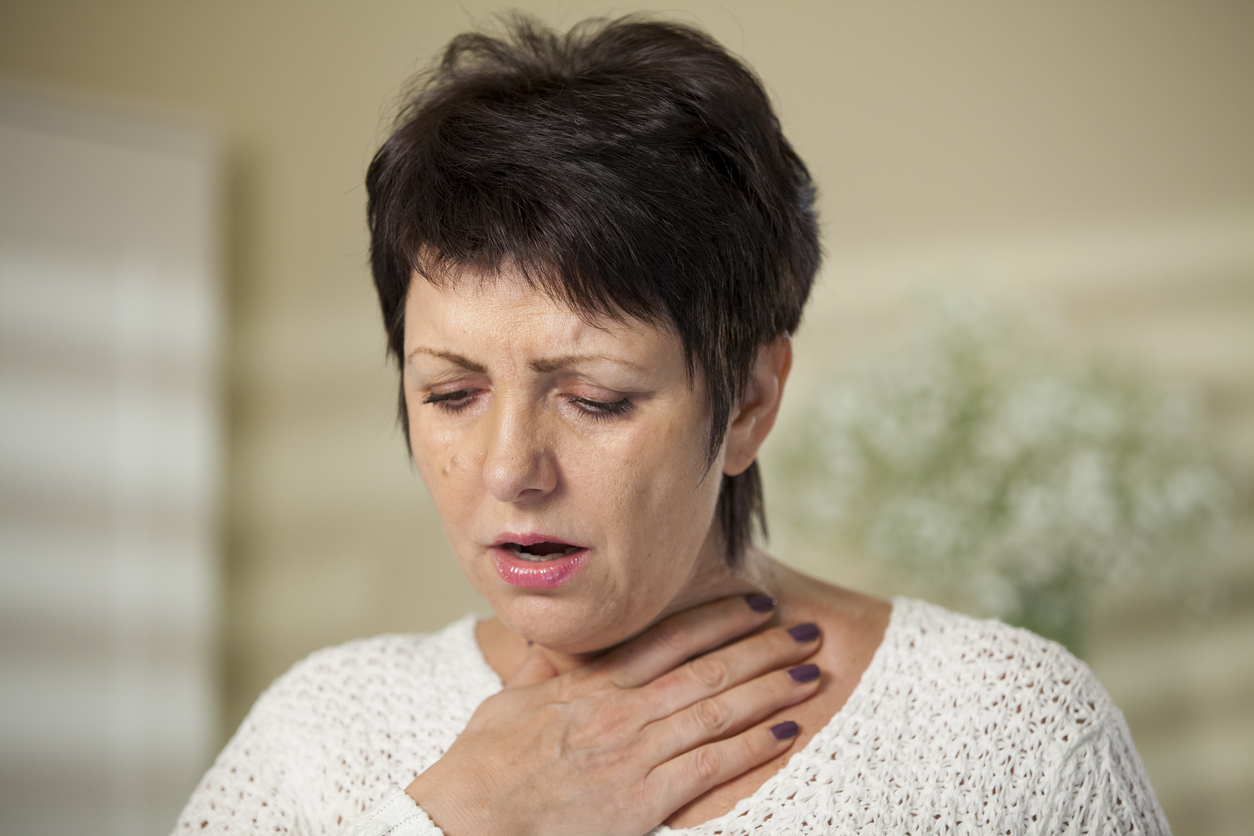 Woman with sore throat