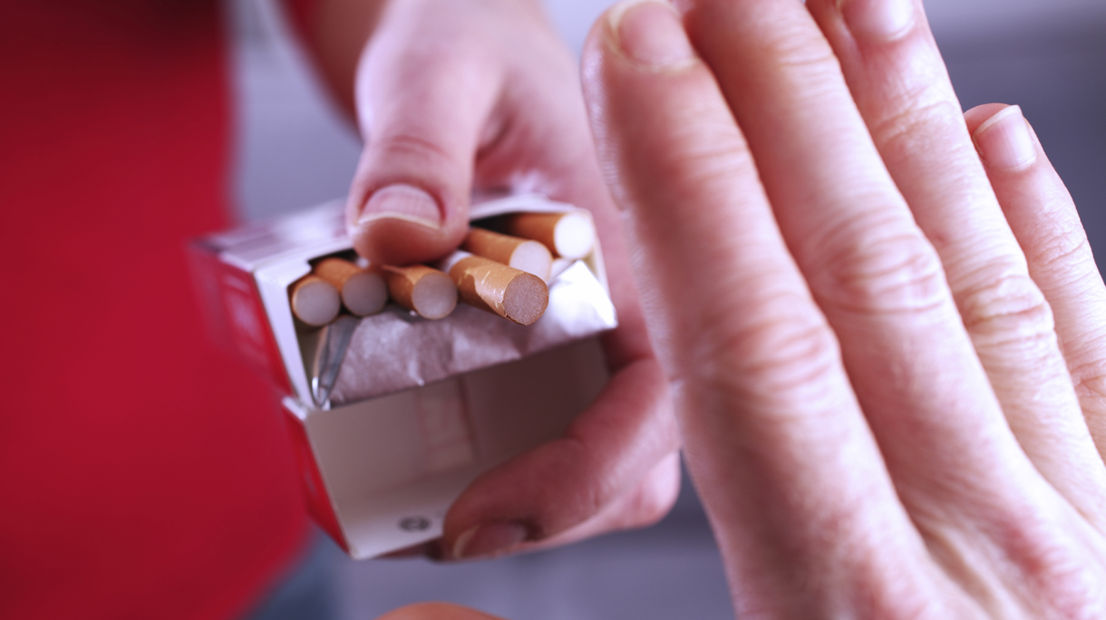 Hand refusing cigarette