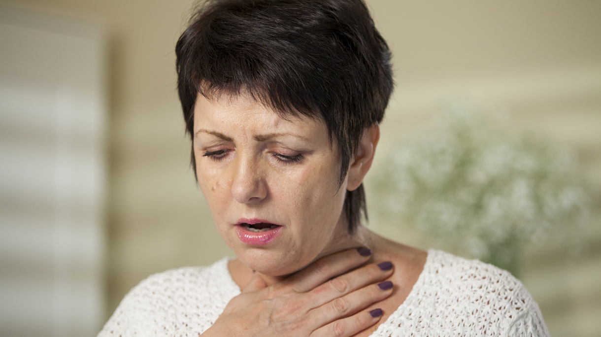 Woman with sore throat