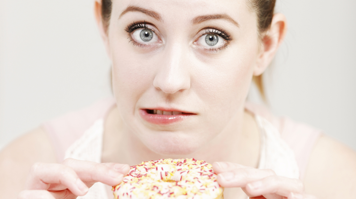 Woman eating a doughnut