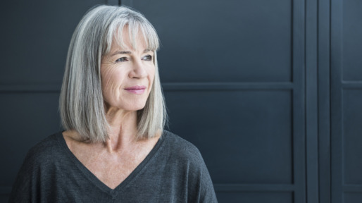 Senior woman with gray hair looking away