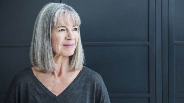 Senior woman with gray hair looking away