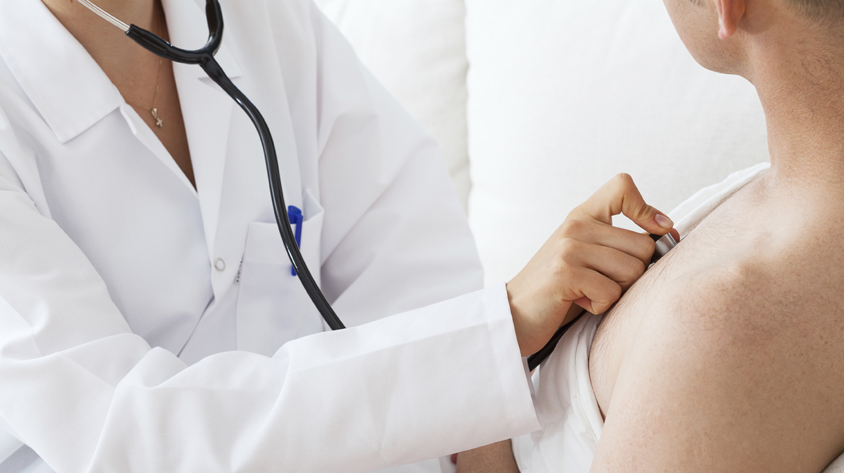 Doctor auscultating a patient
