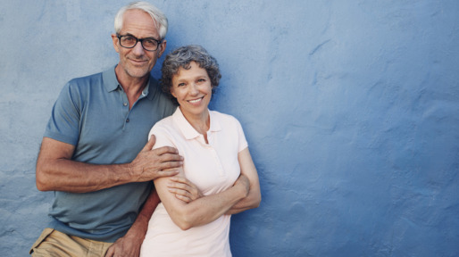Happy mature couple standing together