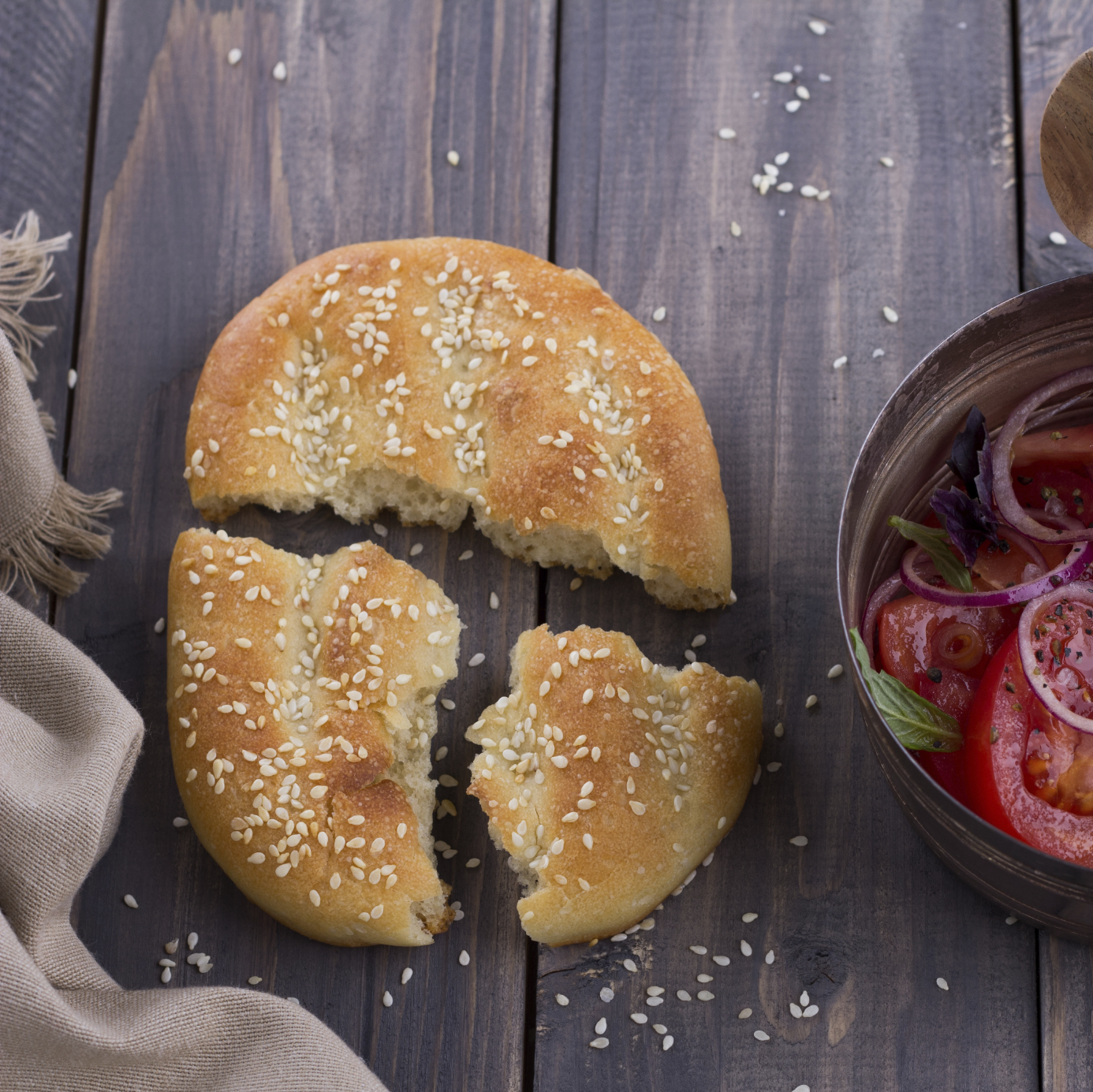 Sesame flat bread with a salad of tomatoes