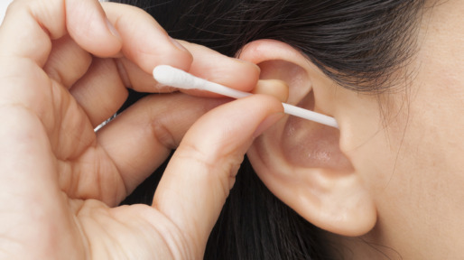 Woman cleaning ear