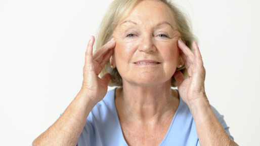Senior woman showing her face, effect of aging