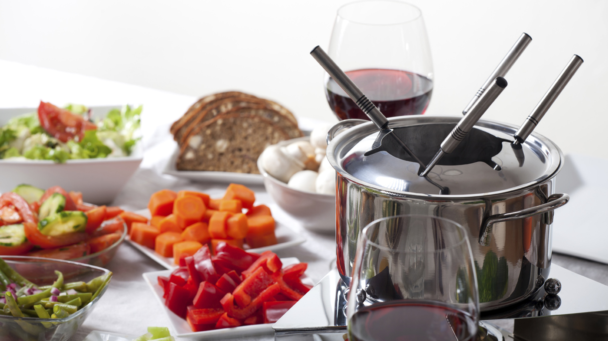 table with fondue set and ingredients