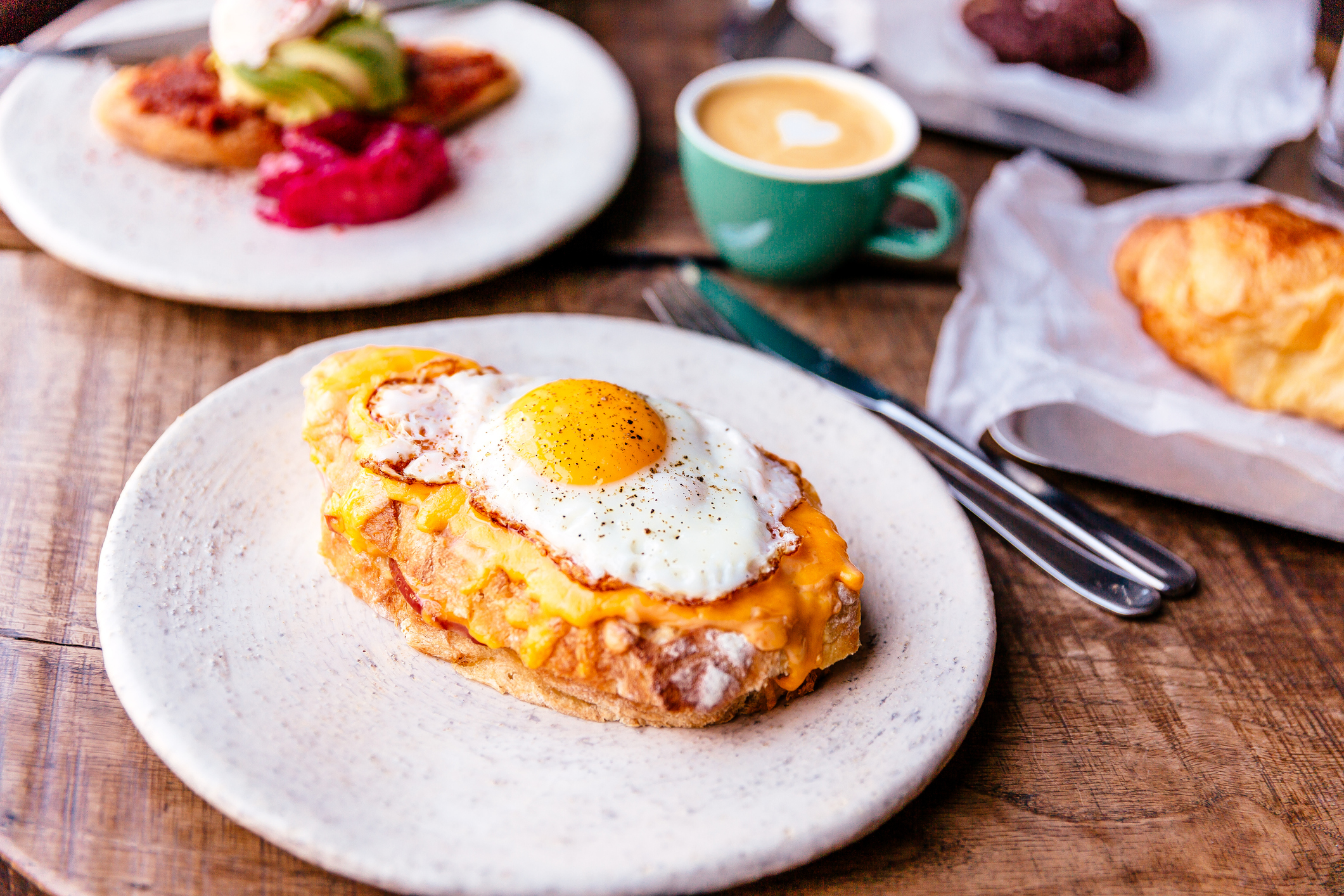 Close-up of croque madame with fried sunny side up egg on the table
