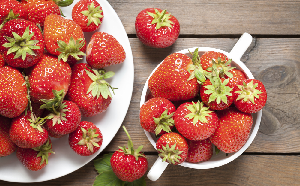 Strawberries on old wooden table