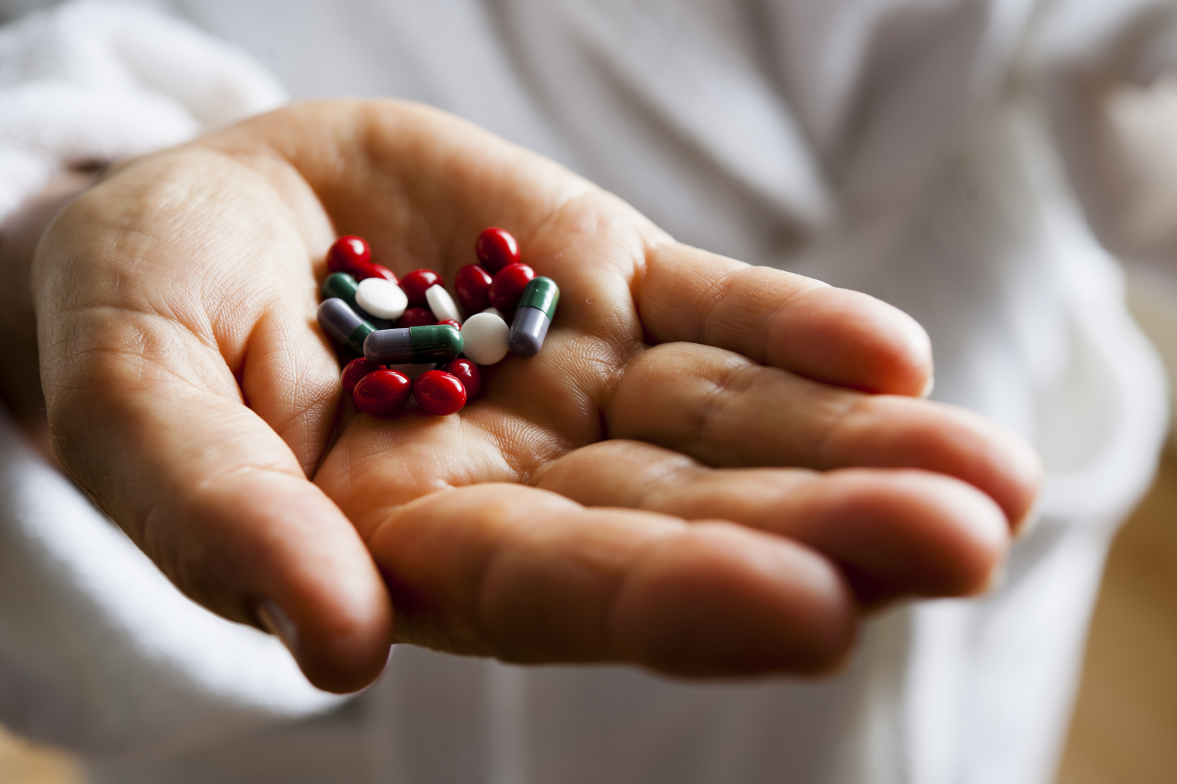 Hand holding pills