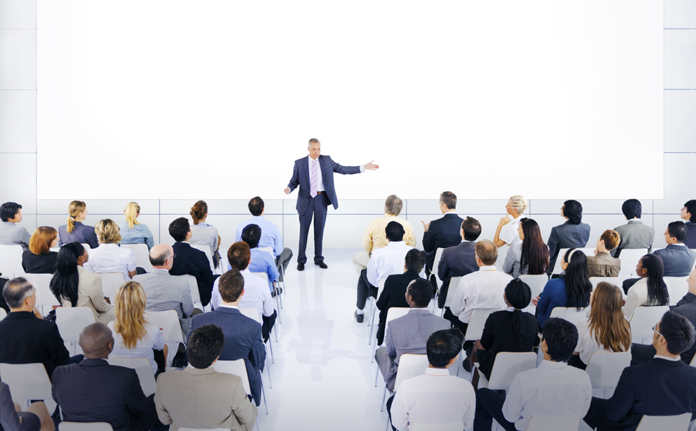Group Of Business People Listening To A Speech