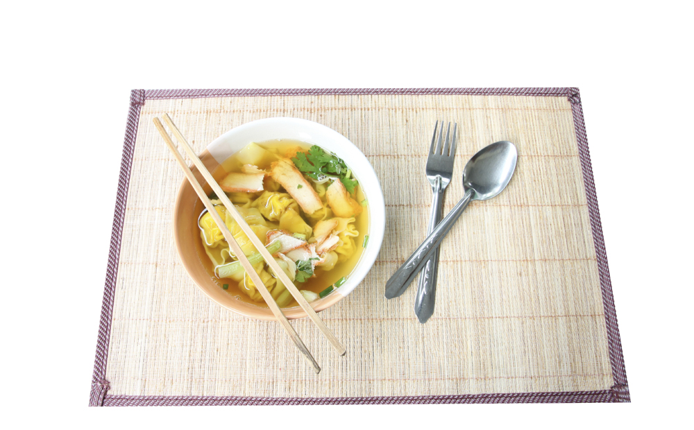Wonton noodles soup in bowl on plate wooden.