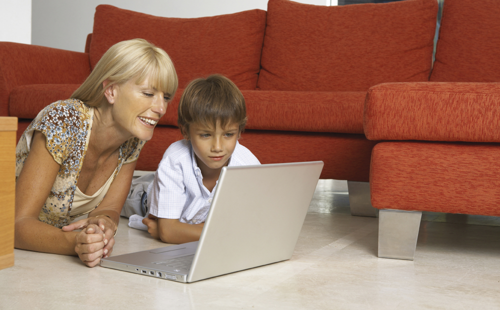 Mother and son with a laptop.