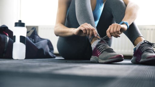 Woman tying shoelaces