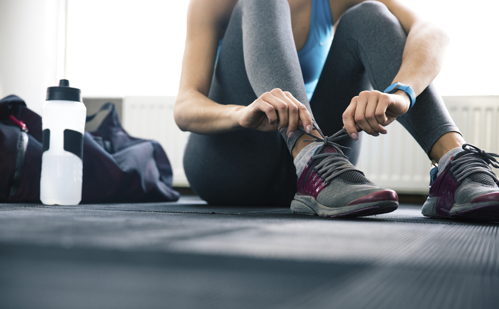 Woman tying shoelaces