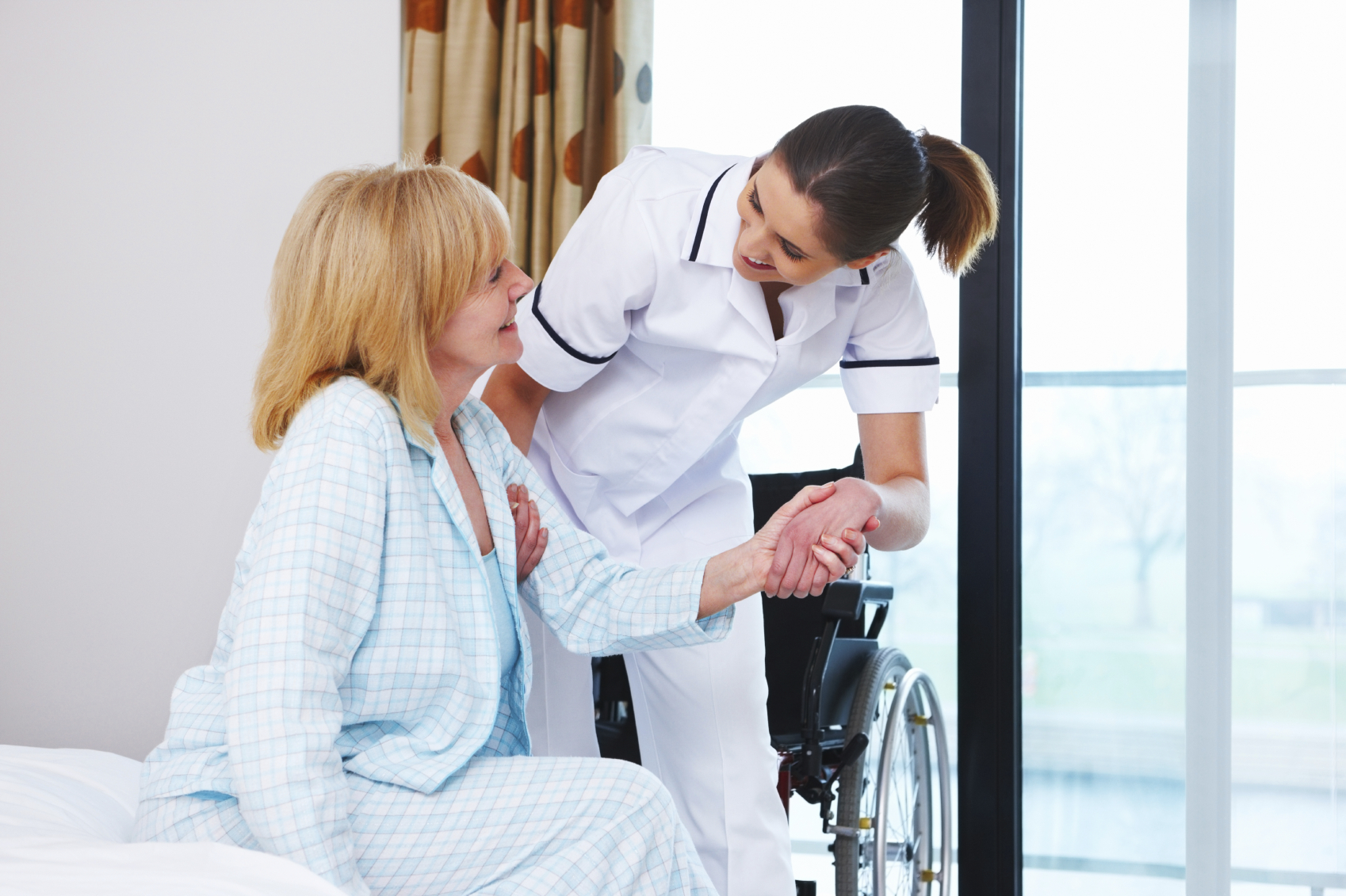 Nurse Helping an Elderly Woman Up