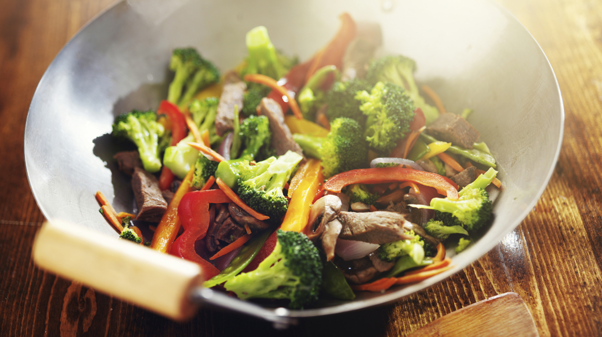 chinese stir fry in wok with beef and vegetables