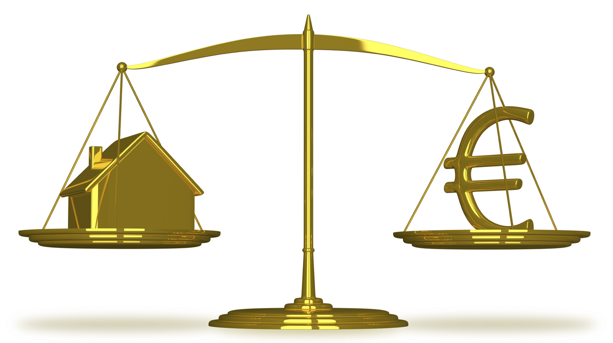 Golden house and euro sign on scales