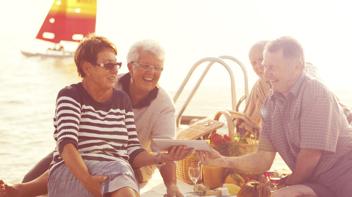 acitve and modern happy seniors with ipad