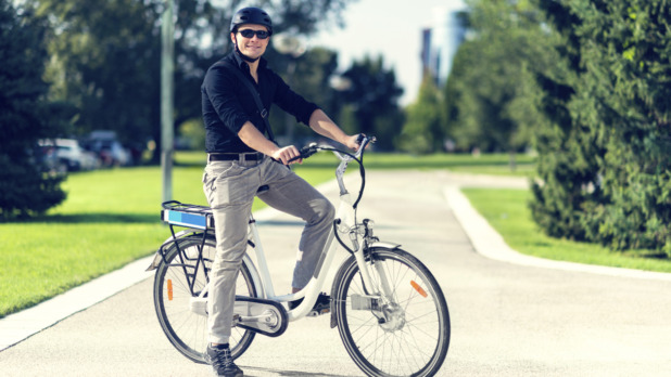Businessman using bicycle sharing system