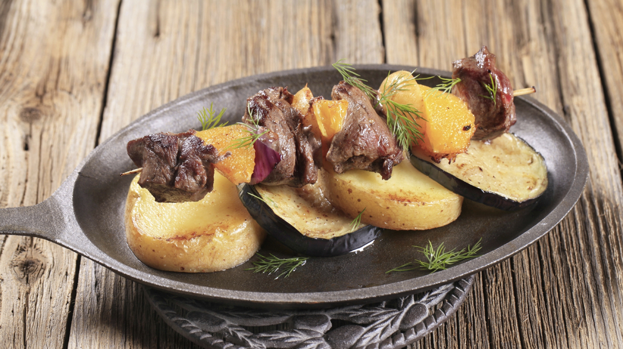 Meat skewer with baked potatoes