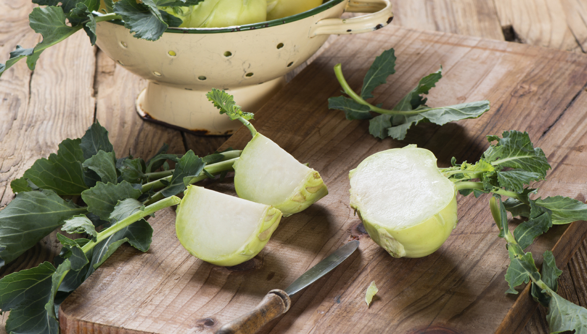 Kohlrabi cabbage on dark wooden