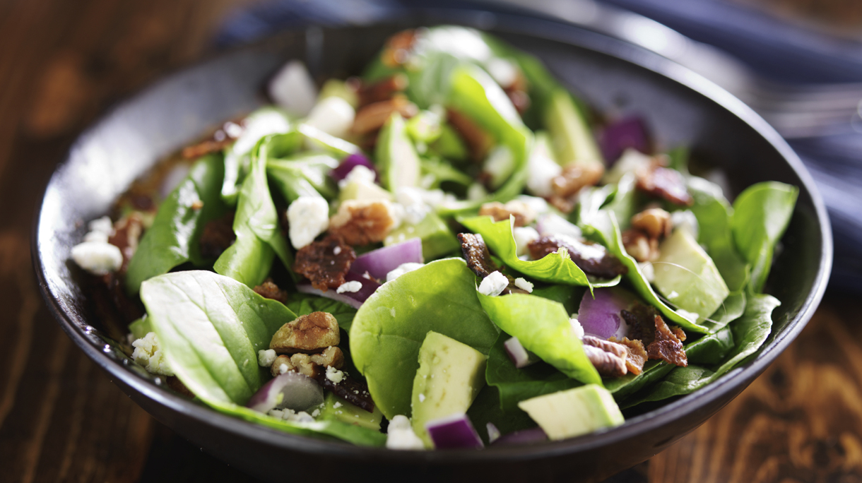 bowl of fresh avocado spinach salad