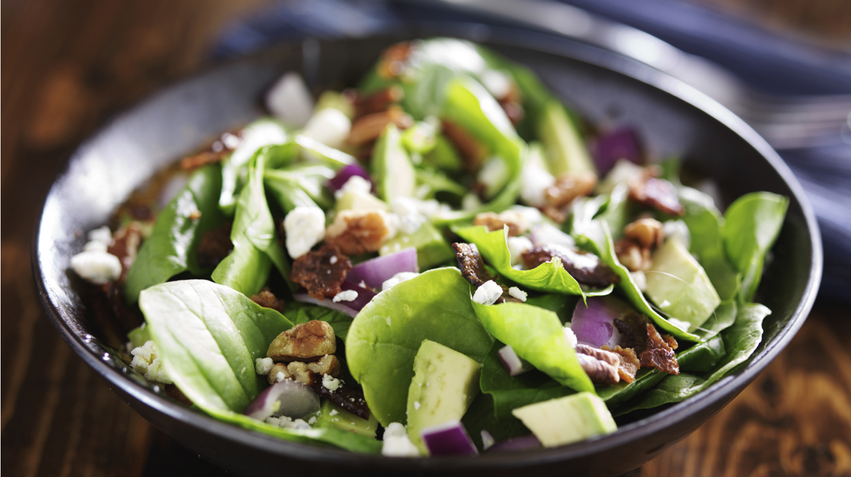 bowl of fresh avocado spinach salad