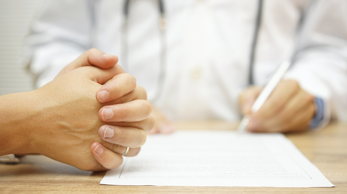 hands of Concerned Women for a medical report written by a docto