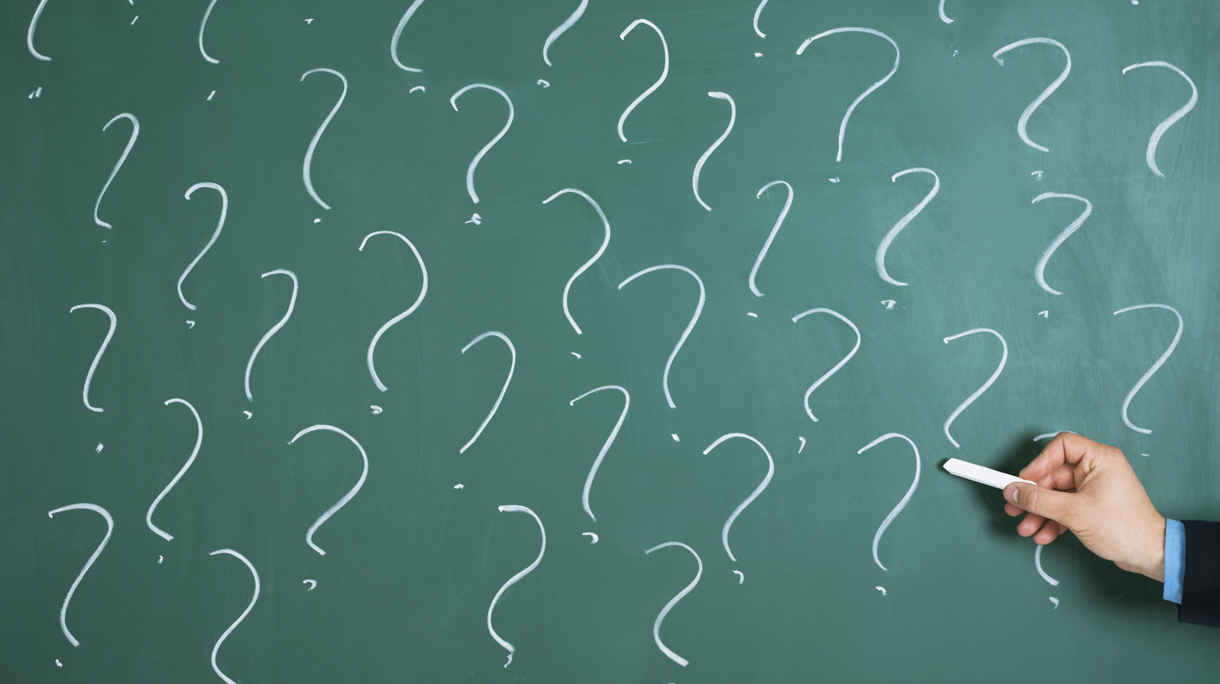 Businessman Drawing Question Mark Sign