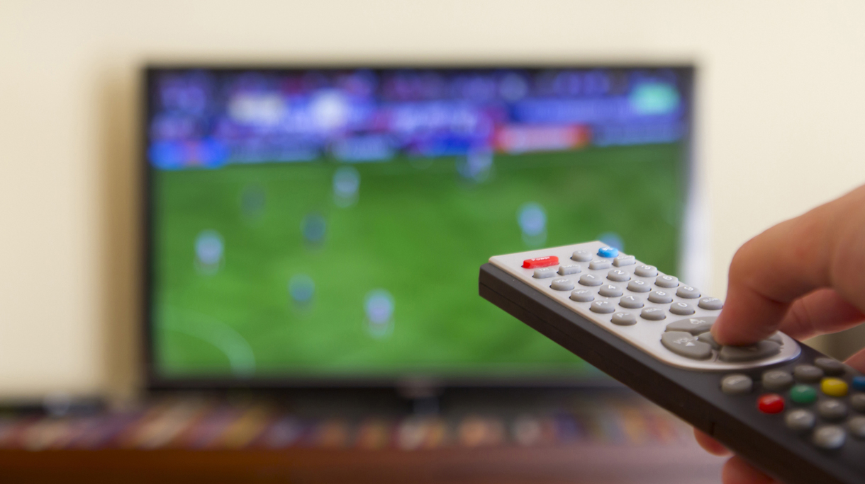 Television remote control in human hands