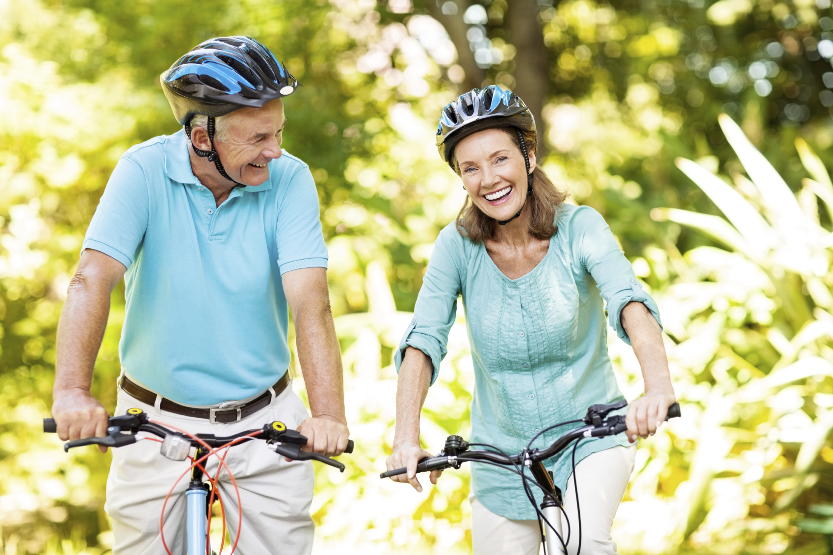 Active Senior Couple With Bicycles In Park