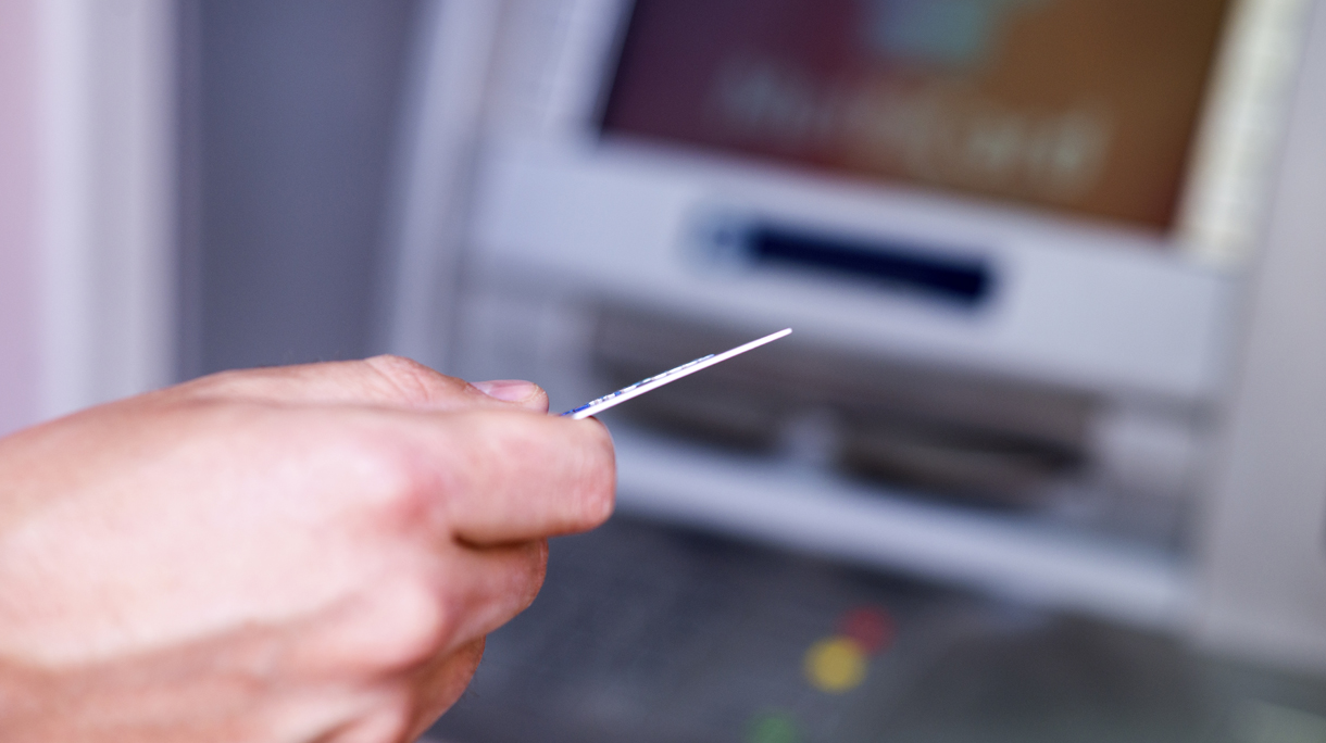 ATM Machine and Mans Hand