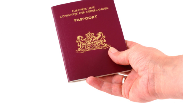 Handing over passport.