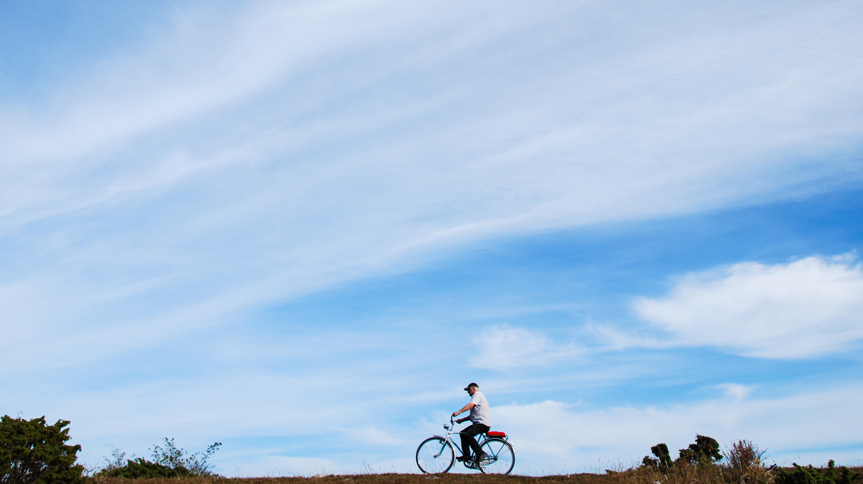 Biking in a plain landscape