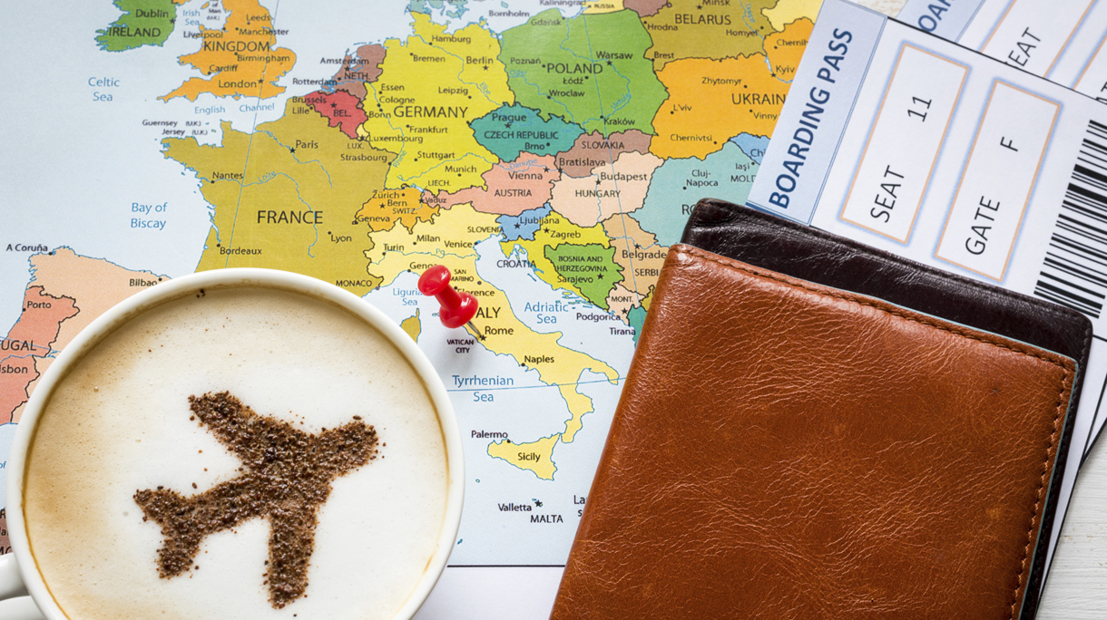 Airplane made of cinnamon in cappuccino, Passports and Europe map
