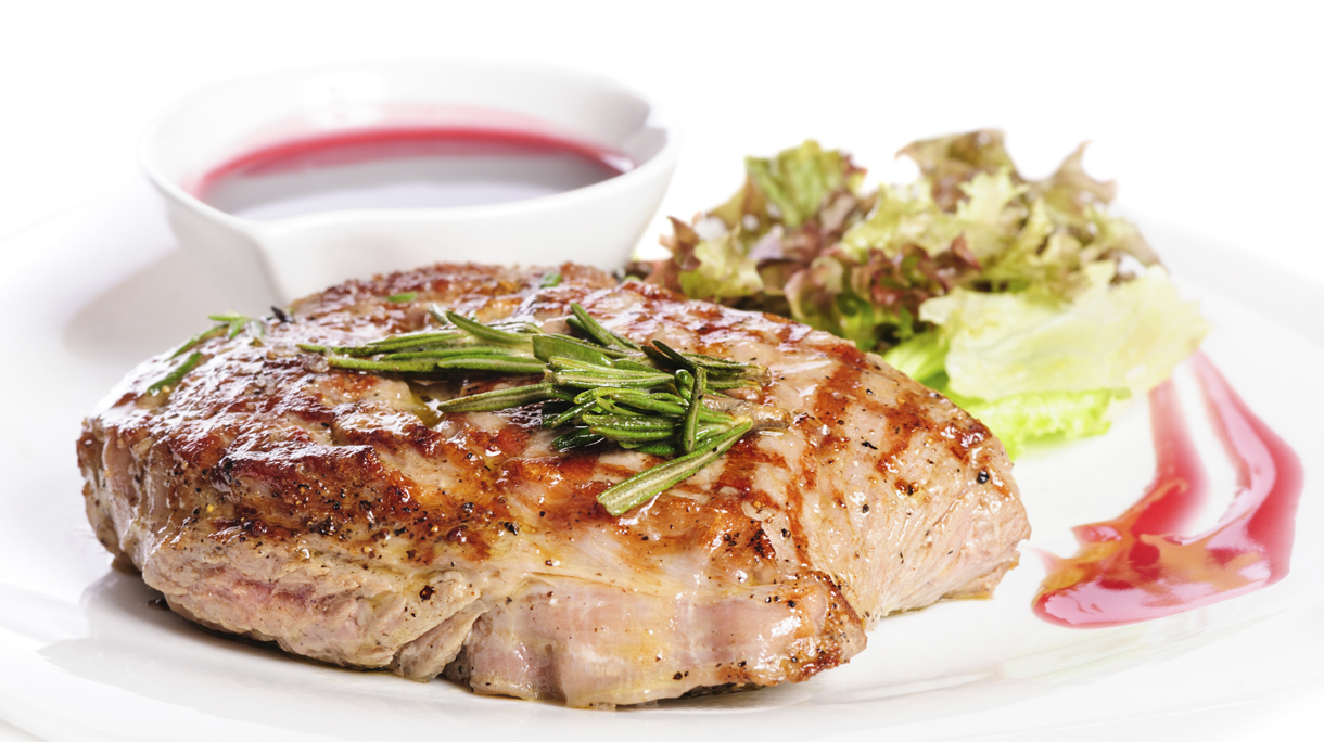 Grilled steaks and vegetable salad