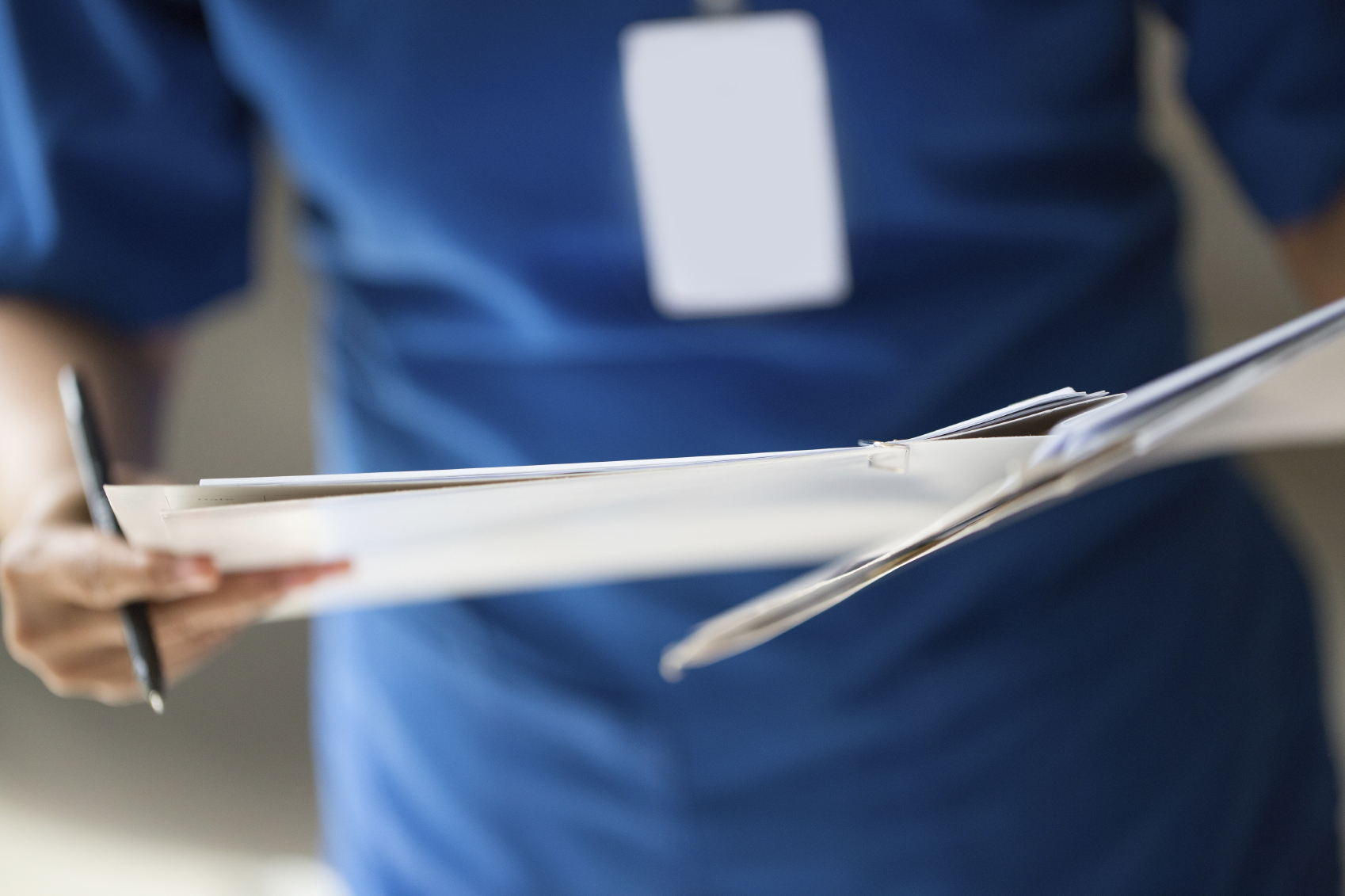 Nurse checking patient document