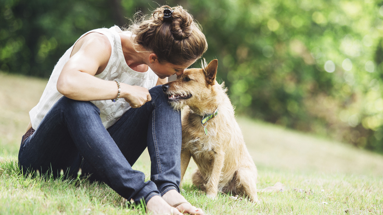 Adult Woman Enjoying Time with Pet Dog