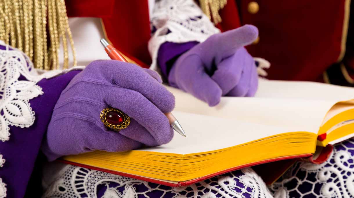 hands of sinterklaas with book
