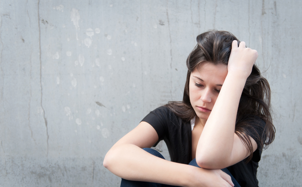 Teenage girl looking thoughtful about troubles