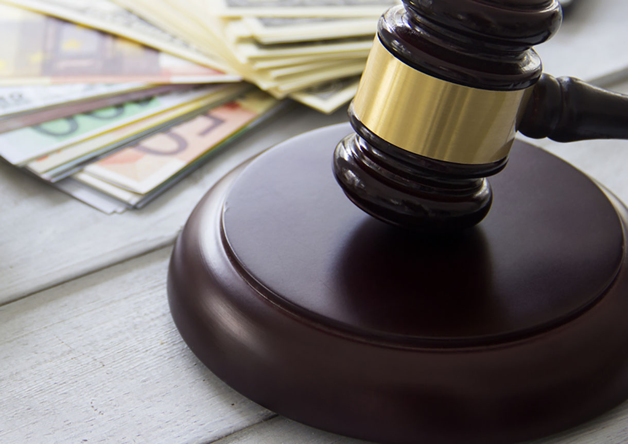 Labor law concept, scale, gavel, money and calculator
