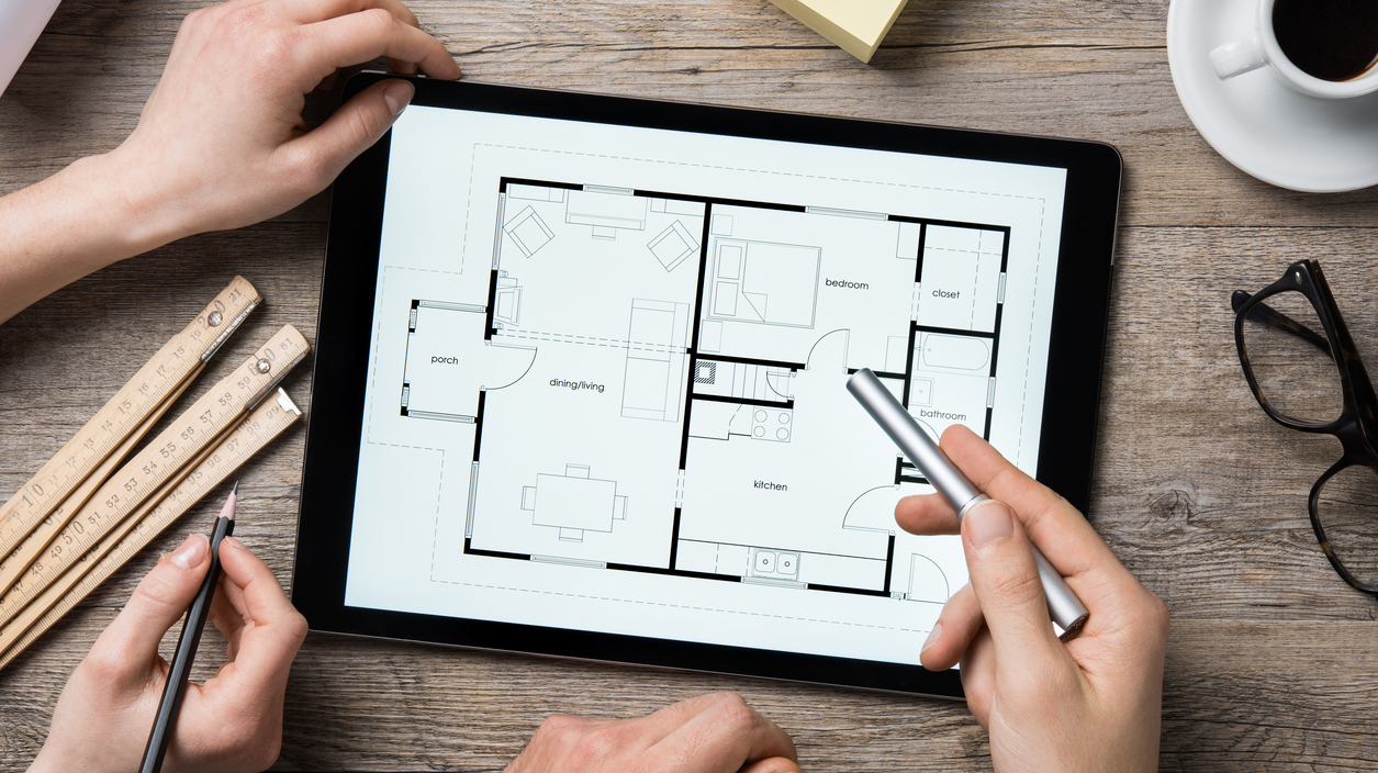 Architect working on digital tablet