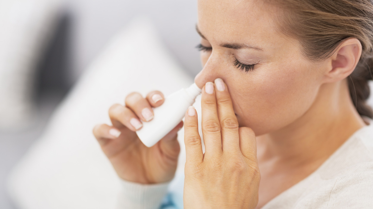 woman using nasal drops